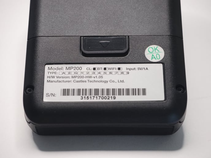 Close up shot of the back of a Pocket device, showing the serial number